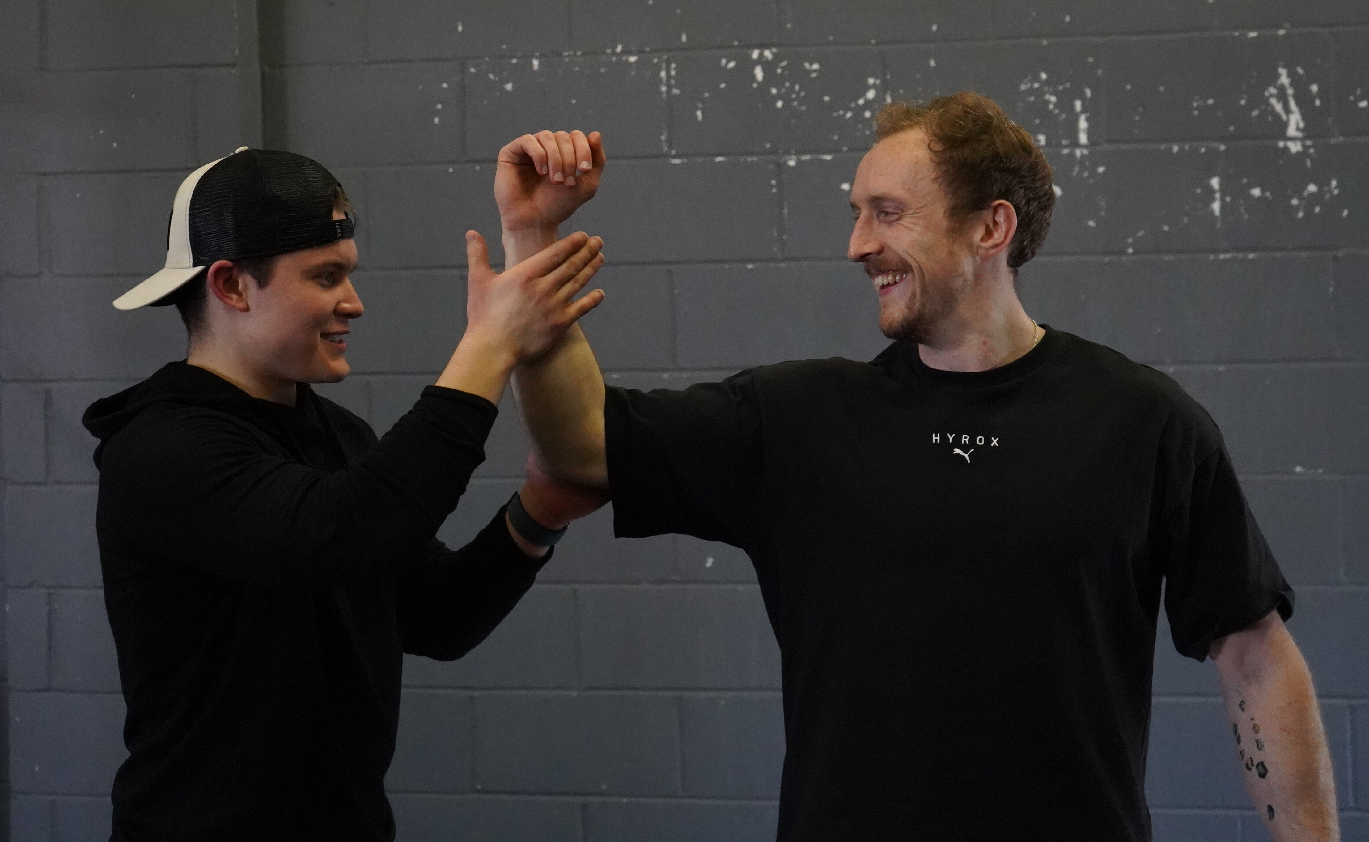 Thomas Yarrow working with athlete in gym